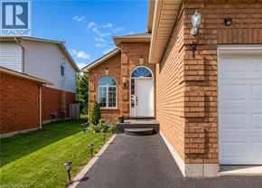 Caledonia apartment for rent - A house with a white garage door and a brick wall.