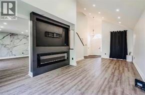 Caledonia apartment for rent - A modern living room with a fireplace and a flat screen TV.