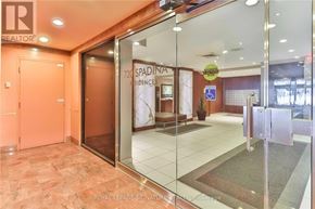 Toronto (University) apartment for rent - The image shows the entrance to a Spadina residences building with a glass door and a Royal LePage sign.