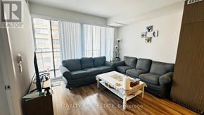 Toronto (Bay Street Corridor) condo for rent - A living room with a grey couch and a coffee table.