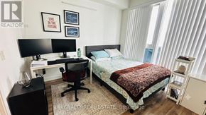 Toronto (Bay Street Corridor) condo for rent - A bedroom with a bed, desk, and chair.