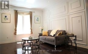 Richmond Hill (Oak Ridges) apartment for rent - A living room with a grey couch, a glass table, and a painting on the wall.