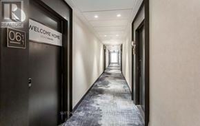 Oakville (Jm Joshua Meadows) condo for rent - A hallway with a sign that says "Welcome Home" on the door.