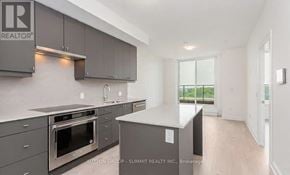 Oakville (Jm Joshua Meadows) condo for rent - A modern kitchen with a large island in the middle.