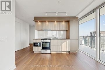 Mississauga (City Centre) condo for rent - A modern kitchen with a stainless steel oven and microwave.