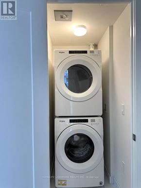 Toronto (Waterfront Communities) condo for rent - A washer and dryer in a small laundry room.