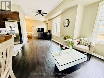 Pickering (Bay Ridges) townhouse for rent - A living room with a white couch and a black coffee table.