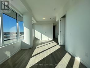 Pickering (Bay Ridges) condo for rent - A sunlit hallway with a view of the outside world.