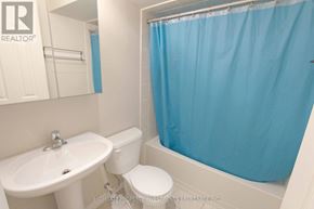 Toronto (Dovercourt-Wallace Emerson-Junction) apartment for rent - A white sink and toilet in a small bathroom.