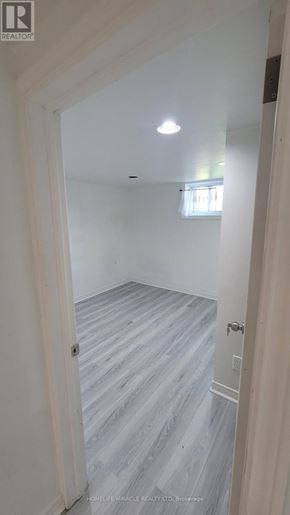 Toronto (West Hill) apartment for rent - A white doorway opens to a room with a grey floor.
