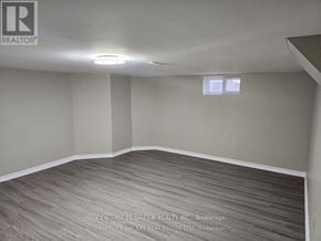 Mississauga (Erin Mills) apartment for rent - A room with a grey carpet and a window with blinds.