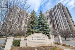Toronto (West Humber-Clairville) condo for rent - The entrance to a residential building named Humberwood with a sign in front.