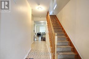 Mississauga (Churchill Meadows) apartment for rent - A hallway with a staircase leading to the second floor.