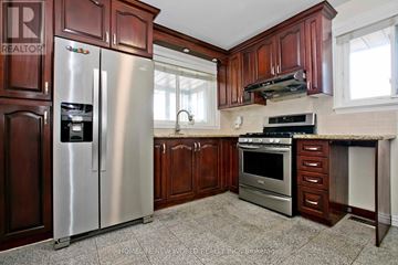 Toronto (Bendale) apartment for rent - A kitchen with a refrigerator, oven, and stove.