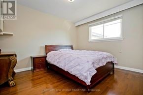 Toronto (Bendale) apartment for rent - A bedroom with a bed, nightstand, and window.