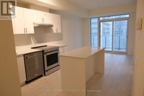 Vaughan (Vellore Village) condo for rent - A kitchen with white cabinets and stainless steel appliances.