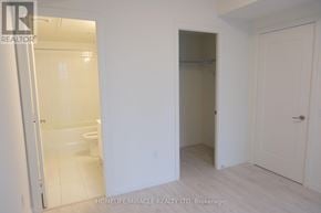 Vaughan (Vellore Village) condo for rent - A white bathroom with a walk-in shower and a toilet.