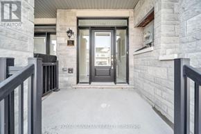 Barrie townhouse for rent - The image shows a front door of a house with a glass panel and a black handle.