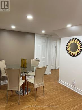 Vaughan (Patterson) apartment for rent - A dining room with a glass table and chairs.