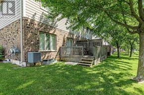 London North (North B) townhouse for rent - A house with a brick wall and a deck.