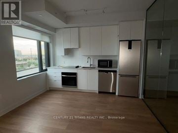 Vaughan (Concord) condo for rent - A kitchen with white cabinets and stainless steel appliances.