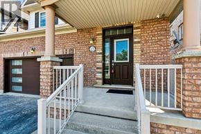 Caledon apartment for rent - A brick house with a black door and a number 15 on the wall.