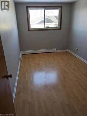 Cambridge apartment for rent - A room with wooden flooring and a window.