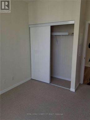 Toronto (Waterfront Communities) condo for rent - A white closet with a door open in a room.