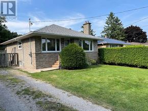 Toronto (Rouge) apartment for rent - A house with a well-maintained lawn in front.