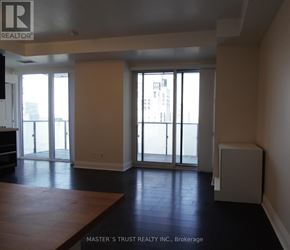Toronto (Bay Street Corridor) condo for rent - A room with a sliding glass door leading to a balcony.