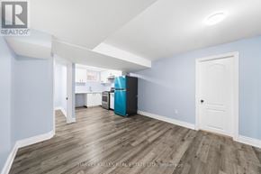 Brampton (Sandringham-Wellington) apartment for rent - A room with a blue wall and a white door.