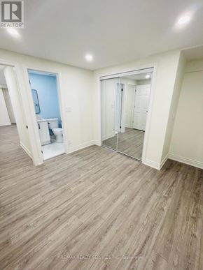 Brampton (Westgate) apartment for rent - A room with a wooden floor and white walls.