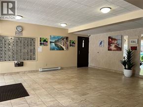 Windsor condo for rent - A realtor office with a white ceiling and a black door.