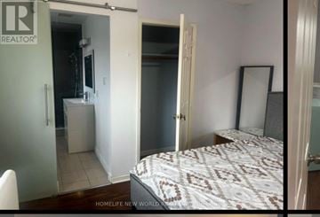 Mississauga (Erin Mills) apartment for rent - A bedroom with a bed, a wardrobe, and a mirror.