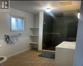 Mississauga (Erin Mills) apartment for rent - A bathroom with a toilet, sink, and shower.