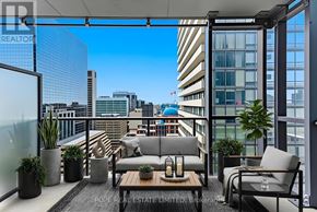 Toronto (Bay Street Corridor) condo for rent - A modern balcony with grey furniture and plants.