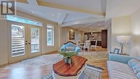 Toronto (Newtonbrook West) apartment for rent - A living room with a wooden coffee table and a striped sofa.