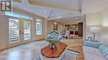 Toronto (Newtonbrook West) apartment for rent - A living room with a wooden coffee table and a striped sofa.