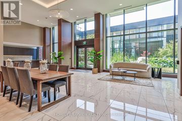 Toronto (Bayview Village) condo for rent - A spacious living room with a dining table and chairs.