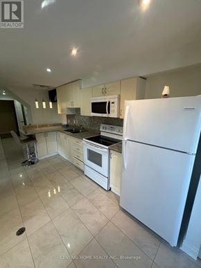 Richmond Hill (Westbrook) apartment for rent - A white refrigerator stands in a kitchen with a countertop and stove.