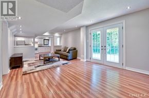 Markham (Wismer) apartment for rent - A spacious living room with hardwood floors and white walls.