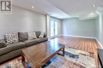 Markham (Wismer) apartment for rent - A living room with a grey couch and a wooden coffee table.
