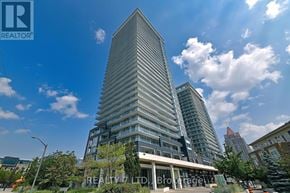 Mississauga (City Centre) condo for rent - A tall building with a pointed top is the focal point of the image.