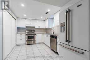 Markham (Village Green-South Unionville) apartment for rent - A white kitchen with a stainless steel oven and dishwasher.