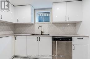 Markham (Village Green-South Unionville) apartment for rent - A kitchen with white cabinets and a stainless steel dishwasher.