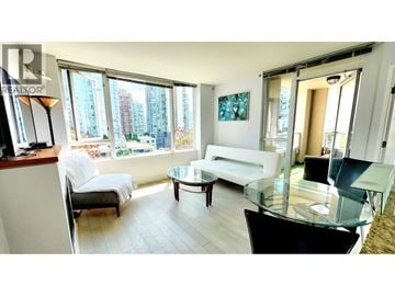 Vancouver apartment for rent - A living room with a glass table and a white couch.