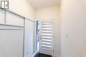 Pickering (Village East) townhouse for rent - A white door with a window in the middle of it.