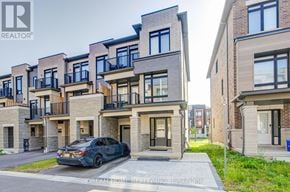 Ajax (South East) townhouse for rent - A black car is parked in front of a modern two-story building.