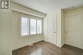 Ajax (South East) townhouse for rent - A room with a window and two doors.