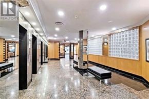 Toronto (Willowdale East) condo for rent - A long hallway with a marble floor and benches on either side.